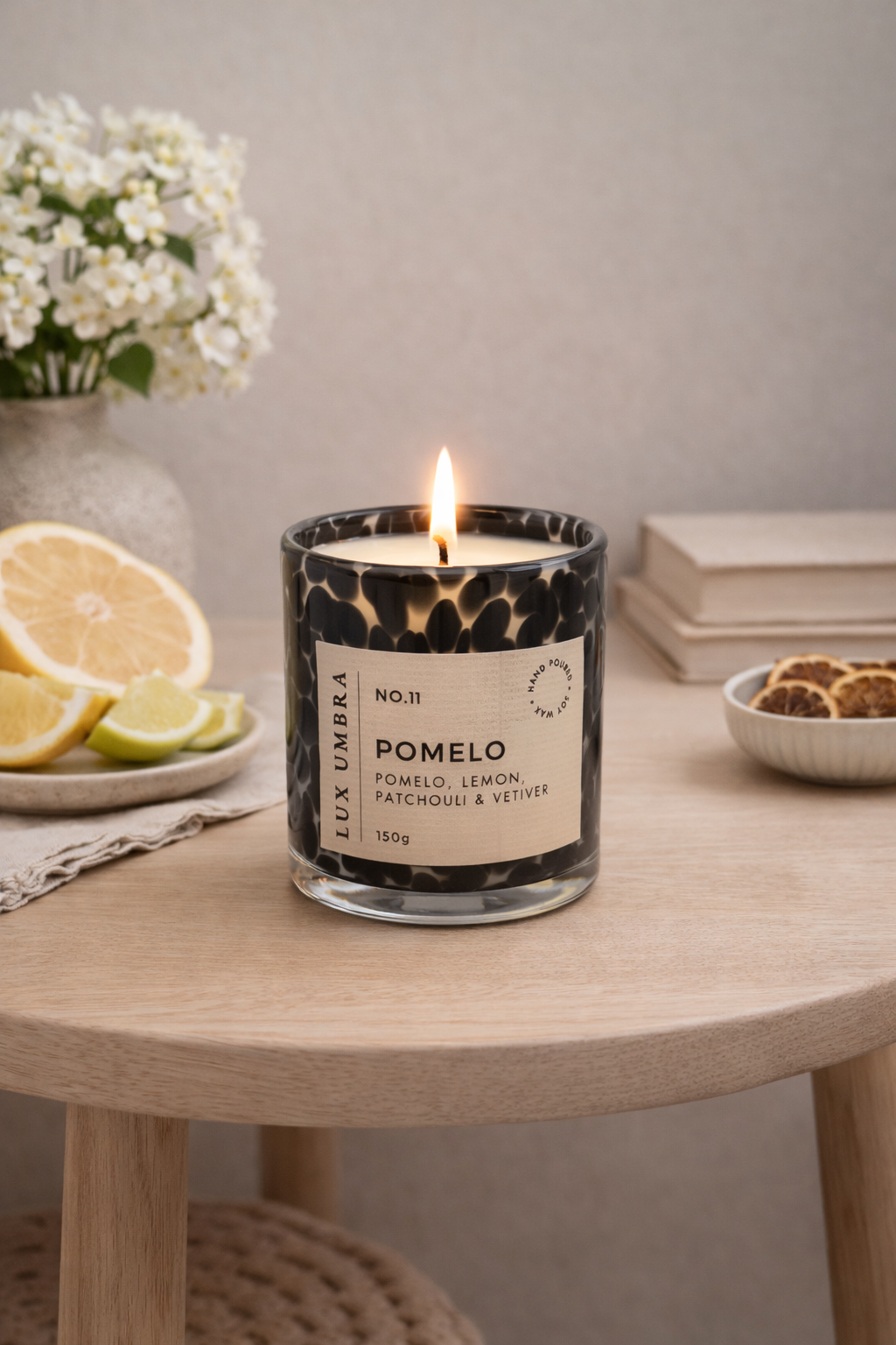 A black tortoiseshell candle called pomelo, on a table