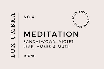 A label for Lux Umbra's MEDITATION room spray, indicating the fragrance is a blend of sandalwood, violet leaf, amber, and musk, and the size is 100ml.