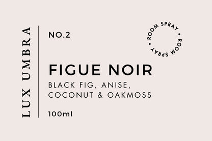 A label for Lux Umbra No. 2 Figue Noir room spray, featuring fragrance notes of black fig, anise, coconut, and oakmoss, and indicating a volume of 100ml.