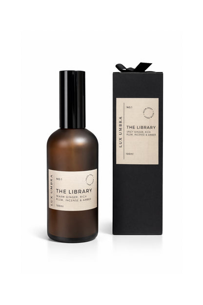 Brown bottle and black box with 'The Library' branding on a white background