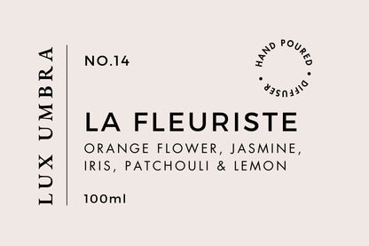 A reed diffuser label for a scent called La Fleuriste by Lux Umbra